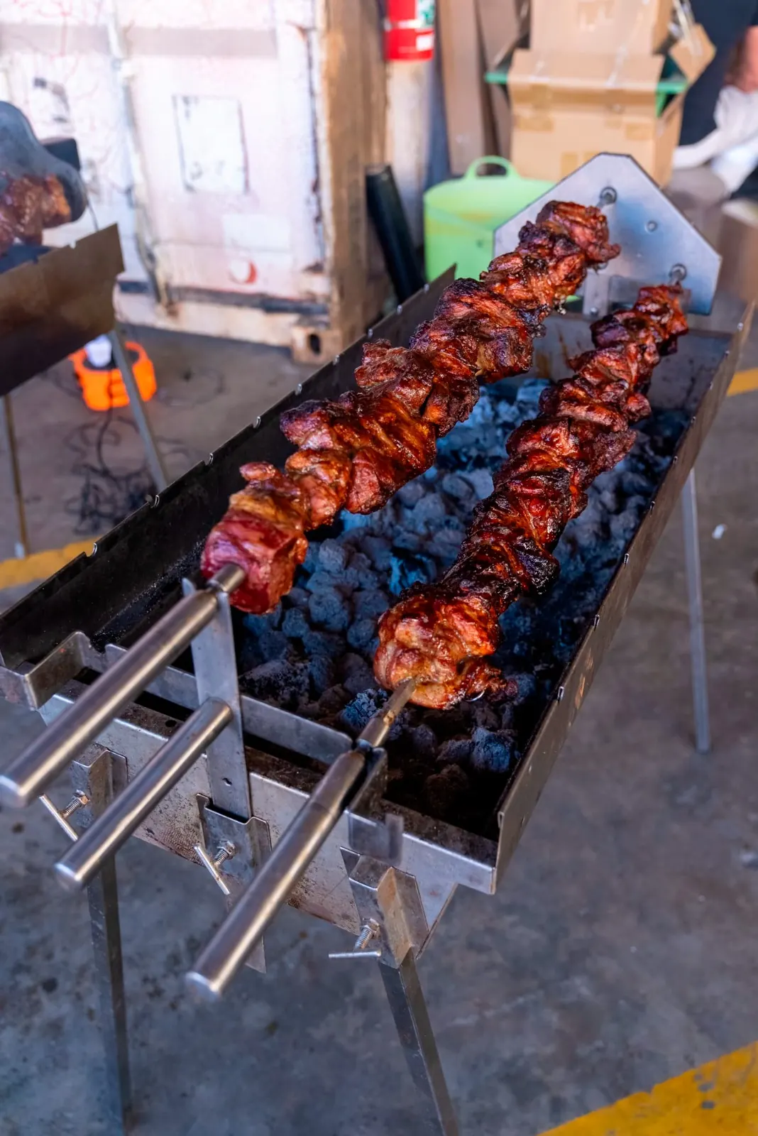 Souvla roasting over charcoal on the spit